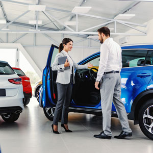  Businessmen, girl with documents, and boy near a blue car, symbolizing business purchase & sale - Manavi Law Group, APLC.